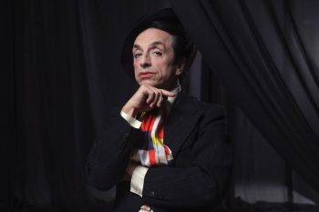 Paul Capsis as Quentin Crisp in a promotional image for Resident Alien